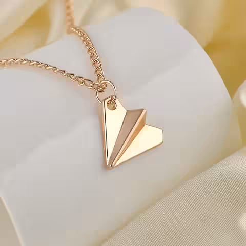 Hänge inspirerat av Harry Styles med design av pappersflygplan