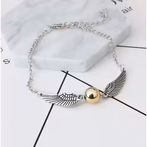 Accesoriu argintiu cu simboluri Harry Potter