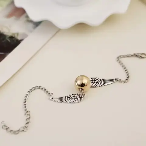 NÁRAMEK Harry Potter Golden Snitch Relikvie smrti Hotoaica ZLATÁ / STŘÍBRNÁ